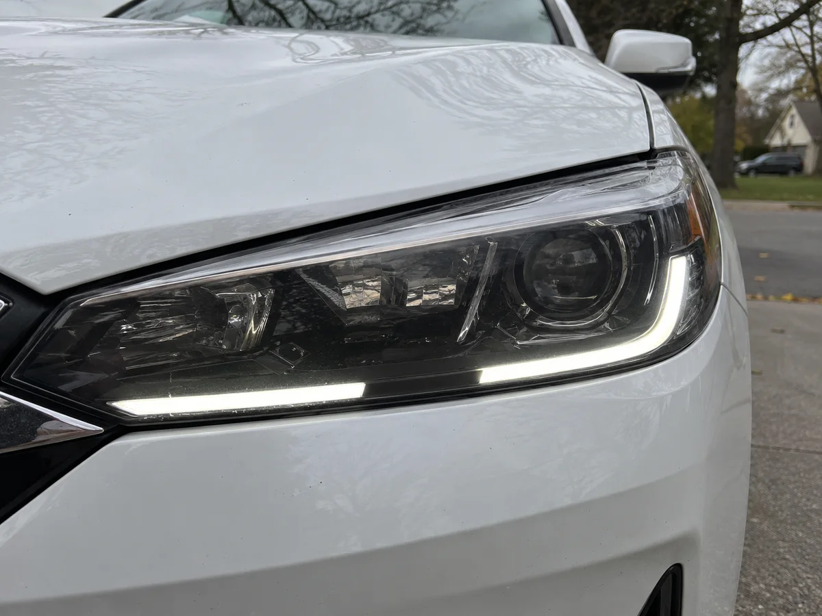 Tenth-generation Accord headlight with the daytime running light strip dark on one section