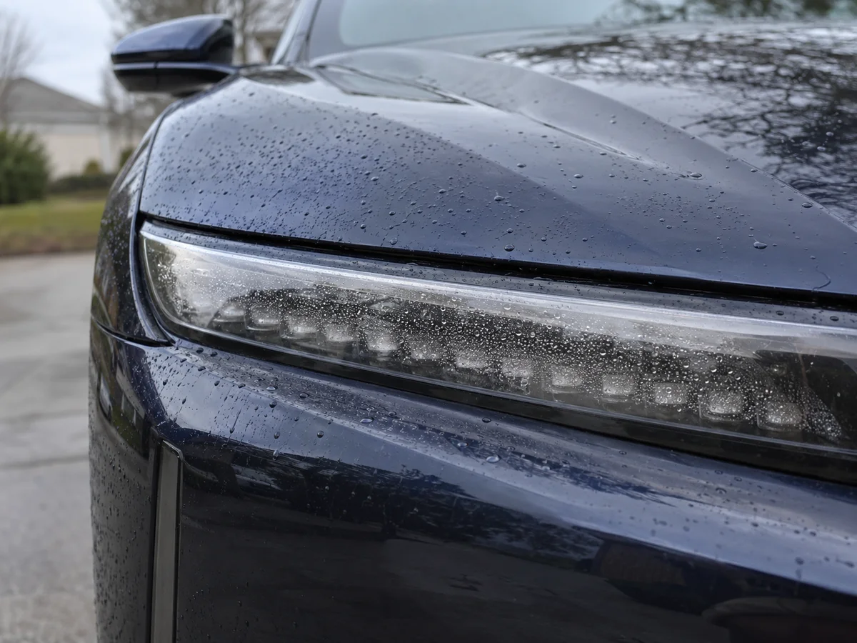Fine condensation droplets on the inside of the lens of a Lucid Air headlight