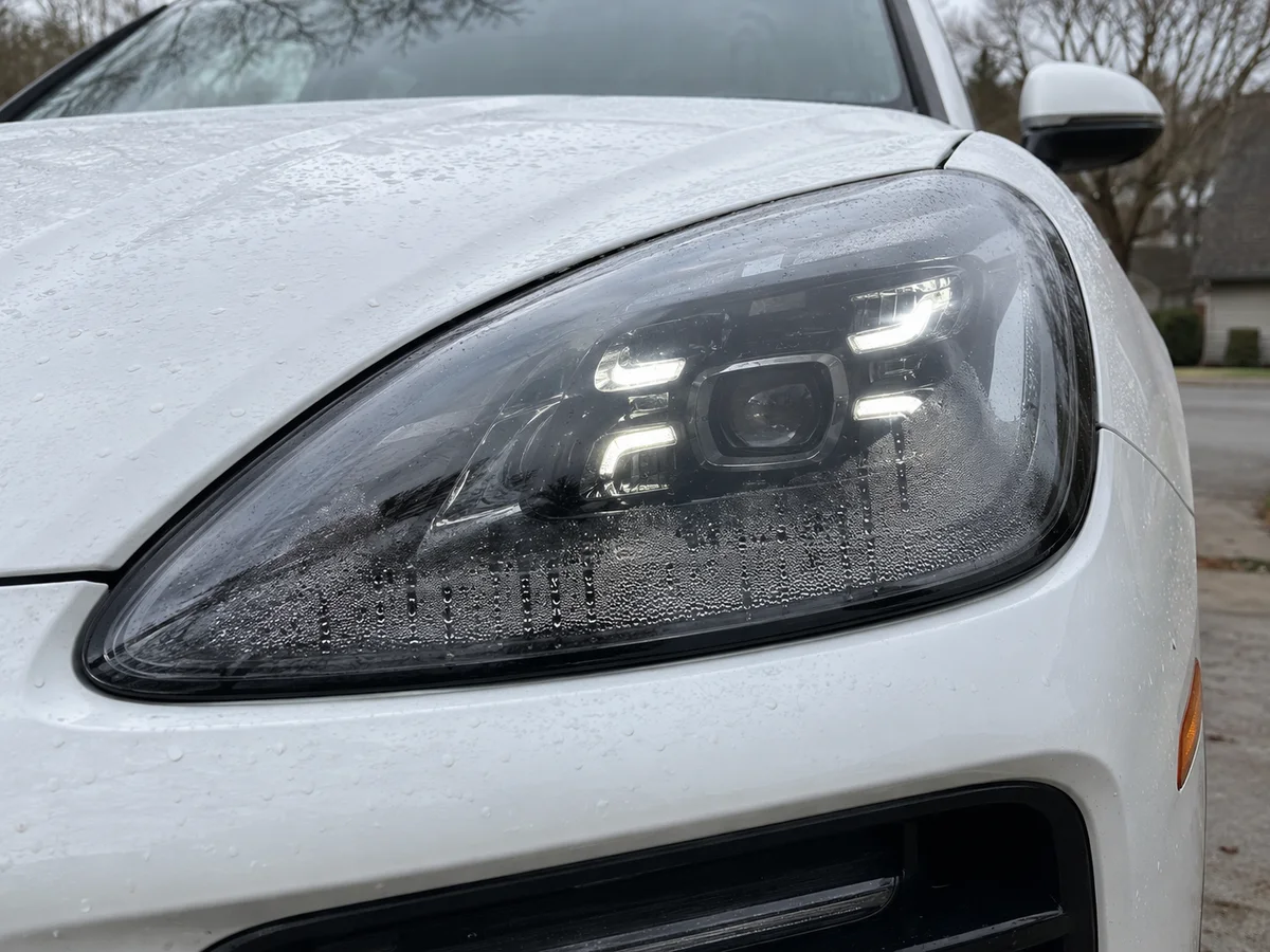 Cayenne LED headlight with water droplets on the inside of the lens