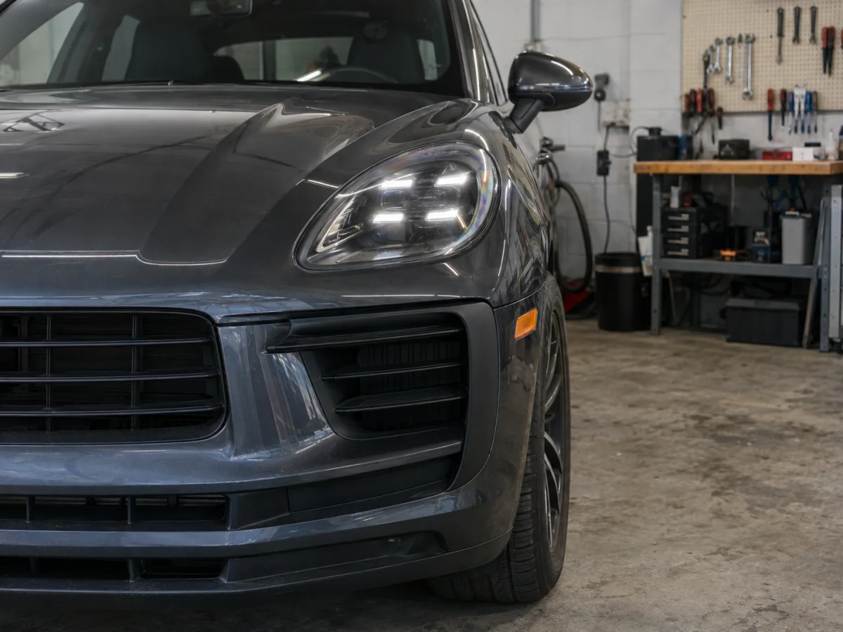 Porsche Macan LED headlight with its four-point daytime running light lit