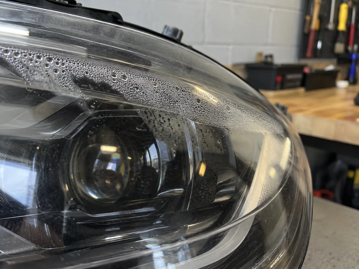 Moisture beads inside the lens of a Model Y headlight